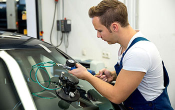 auto glass repair brampton male technician on the job