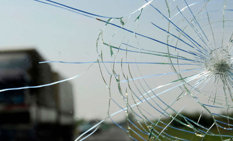 emergency car windshield cracked on highway